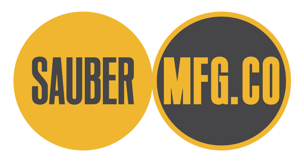 Logo image with two circles one left and one right and adjacent to each other. Left circle is gold with inset grey letters "SAUBER". Right Circle is gray with gold outline and inset gold letters "MFG.CO"